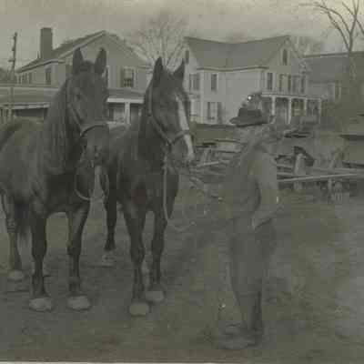 Marshall-Schmidt Album: Man Standing Next to Two Horses