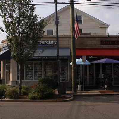 Northeast corner: On Millburn Avenue: Blue Mercury Skin Care, Umi Sushi Restaurant.