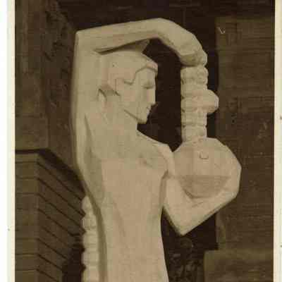 Male sprite holding a geometric dodecahedron, in the Northeast corner of the Winter Garden. This sculpture appeared only once in the Midway Gardens.