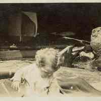 Snow: Child in Front of Stone Fireplace