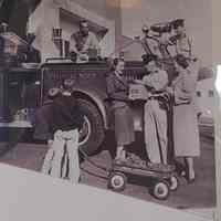 Fire Department: Jimmy Tansey accepting a plug in front of a firetruck