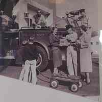 Fire Department: Jimmy Tansey accepting a plug in front of a firetruck