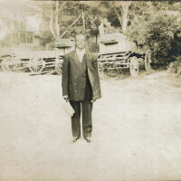 Marshall-Schmidt Album: Man Standing Near Wagons