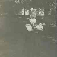 Marshall-Schmidt Album: Margaret Marshall Holding a Puppy