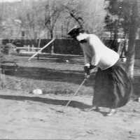 Woman Practicing Golf in Playground, c. 1906