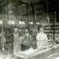          Interior view of factory and male workers at their stations; Photo ID 409 B
   