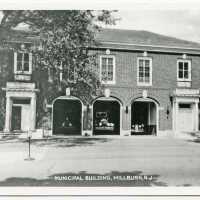 Fire Department: Municipal Building Millburn with Trucks in Bays