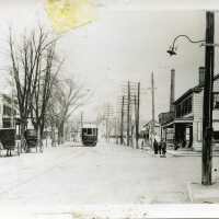 View up Main Street with Horses & Buggies and Trolley