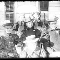 Blood: 4 Women & 2 Girls Seated on a Porch