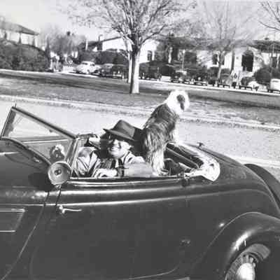 Mort Wagner, designer of the Boulder Dam Hotel, and his dog, Rags December 1947