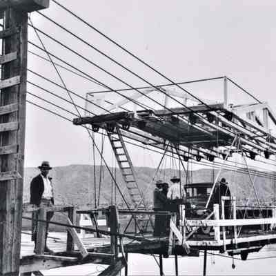 Aerial ferry across Colorado River below Searchlight at Cottonwood Landing 1930-35 showing Mr. R.J. Oppedyck.