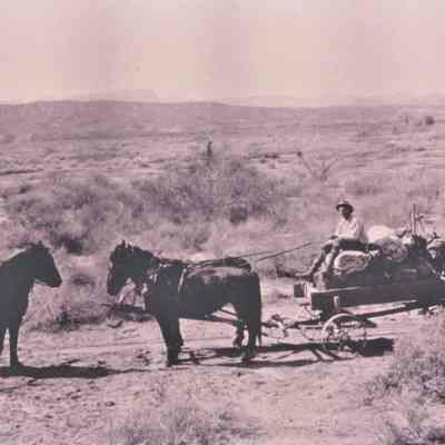 Dr. Mark R. Harrington [horseback] and Fay Perkins [wagon] conducting a reconnaissance of the Virgin River Valley, c. 1920s