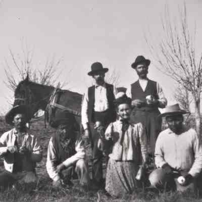 Enjoying apples grown on the Kiel Ranch, ca. 1890s-1900s [note the Paiute/Hispanic men]