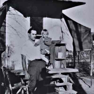 Burt family posed at their home-made trailer house