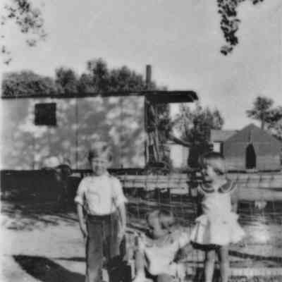 Burt Family posed at their home-made trailer house