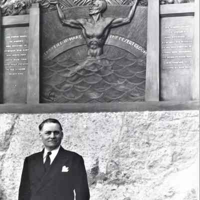 Oskar J.W. Hansen posed at the Hoover Dam workers memorial he designed, December 17, 1937