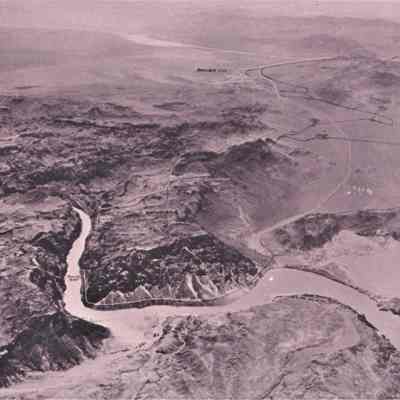 Black Canyon, 1920s-30s: aerial view of the Colorado River and Black Canyon with proposed damsite, Boulder City townsite, and roads and railroads worked, ca. 1920s-30