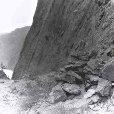 "Stake set on "D" Line by Homer Hamlin in 1916. Original Location. Site "D" was the one finally chosen for construction of Hoover Dam." [photo taken April 30, 1931]