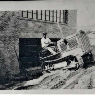 Boulder City schools: Boulder City School under construction, 1932 [Hobert Blair grading the hill on the east side of the school building]