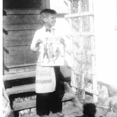 Billy Buck with newsboy bag at 631 Ave I. 1935