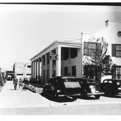 Boulder Dam Hotel 1939. Uptown Hardware Store & Apartments; under construction in the background