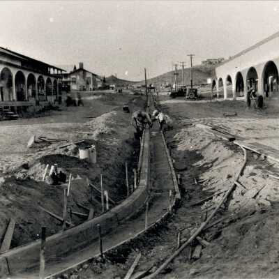 New Mexico Construction Company installing curbing along Birch St. 1931