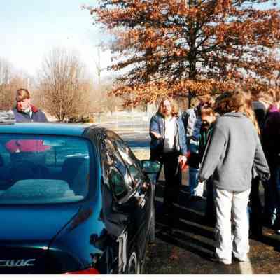 Group of students and teachers by car during Winterim class