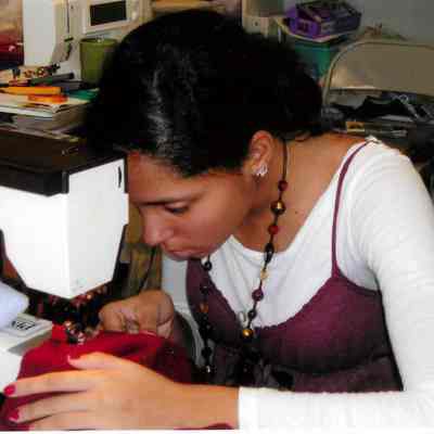 Student works on sewing machine