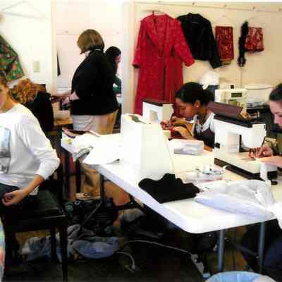 Student work on sewing machines