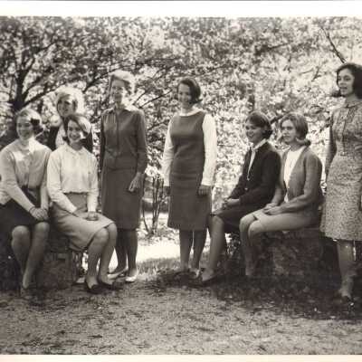 Students and faculty member pose outside, 1960s