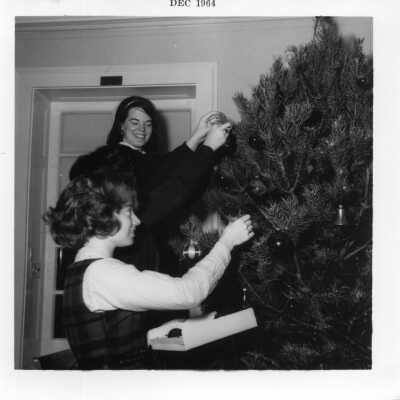 Students decorate Christmas tree in December 1964.