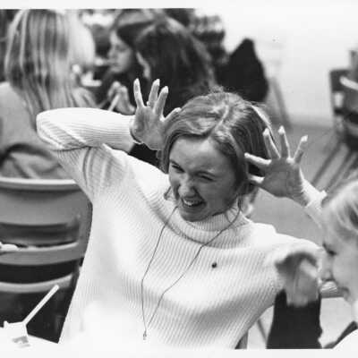 Girls seated, probably in cafeteria.