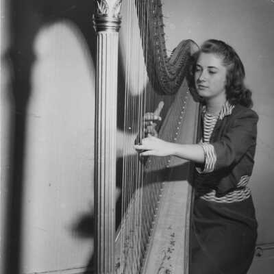 Student Playing The Harp