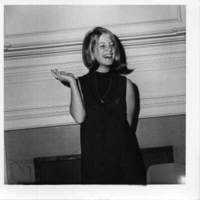Miscellaneous shot of student in front of a fireplace circa 1960.