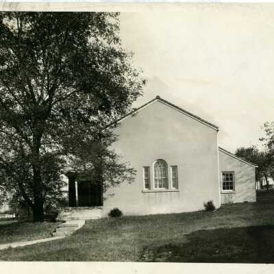 Club village, Exterior view. Penciled on back looks like "T.C." so this might be the Twentieth Century club house, needs verification.