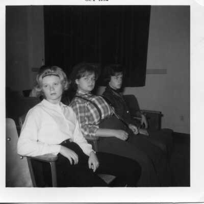 Students dressed in costume sitting in the seats of the auditorium in 1962.
