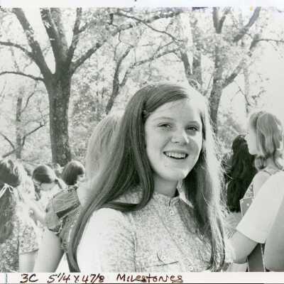 Barbara Massie Hunt stands outside with other students