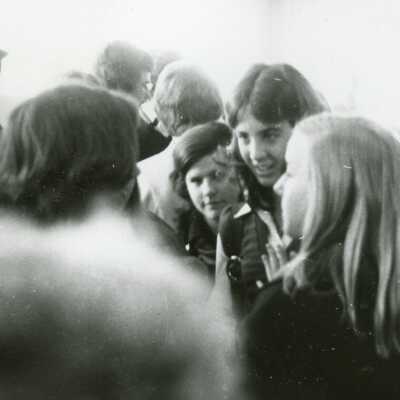 Several students talking in the 1970's.