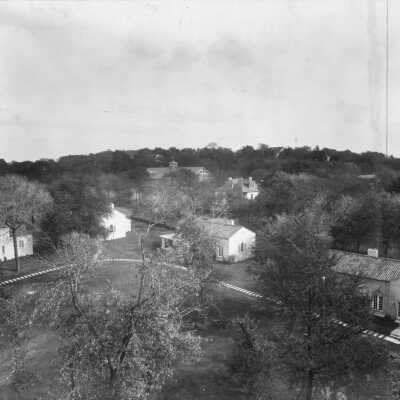 Picture of Ward-Belmont Club Village taken from a high vantage point, either aerial or from the bell tower. Several club exteriors are visible.