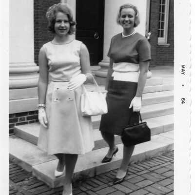 Two well dressed students in front of a building (not HH) in May of 1964.