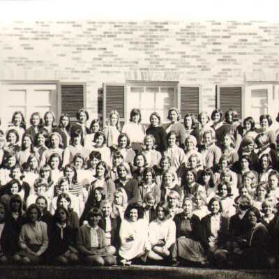 Students in a group pose outside Souby Hall, 1960s