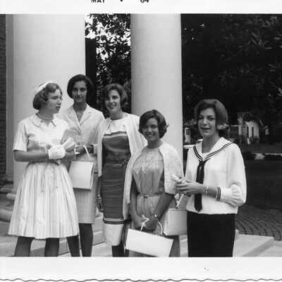 Five well dressed students in front of a building (not HH) in May of 1964.