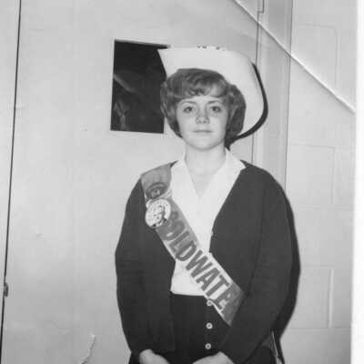 Student in a political costume with a Goldwater sash and some 1964 Presidential butoons wearing a cowboy hat circa 1960s.