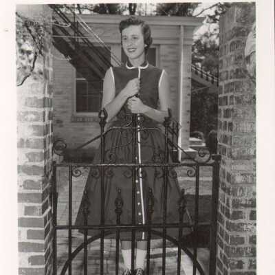 Student at iron gate next to Souby Hall, 1960s