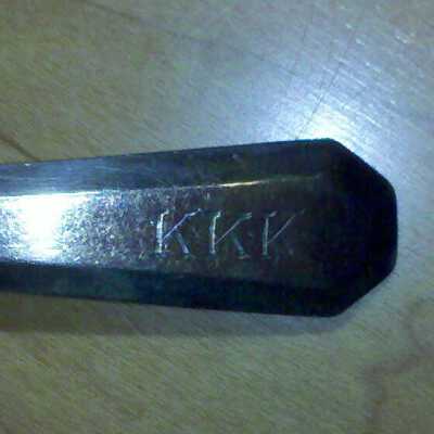 Tri-K fork inscription