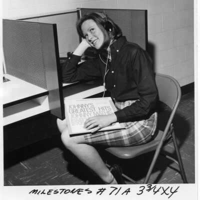 Helen Bransford listening to a record album