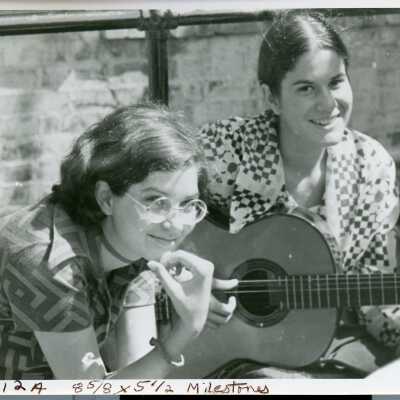 Student playing guitar, 1971