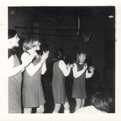 Students in cheerleading outfits, 1960s