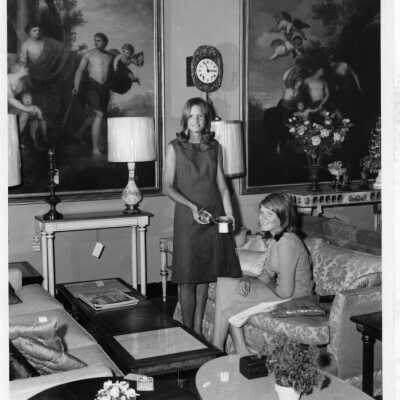Two students pose for an ad for Period Furniture in 1966.