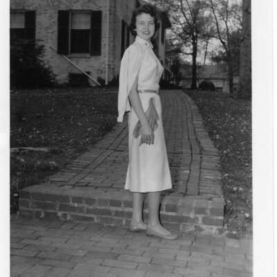 Upper School student on walkway to Souby Hall (no uniform) in the 1960s.